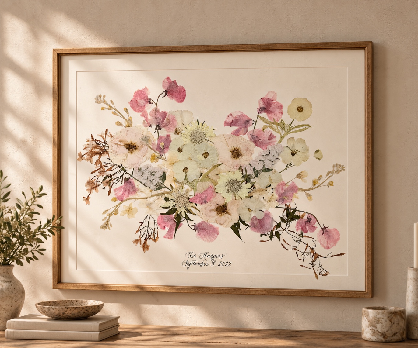 Framed pressed-flower artwork Danielle created from the bride's wedding bouquet